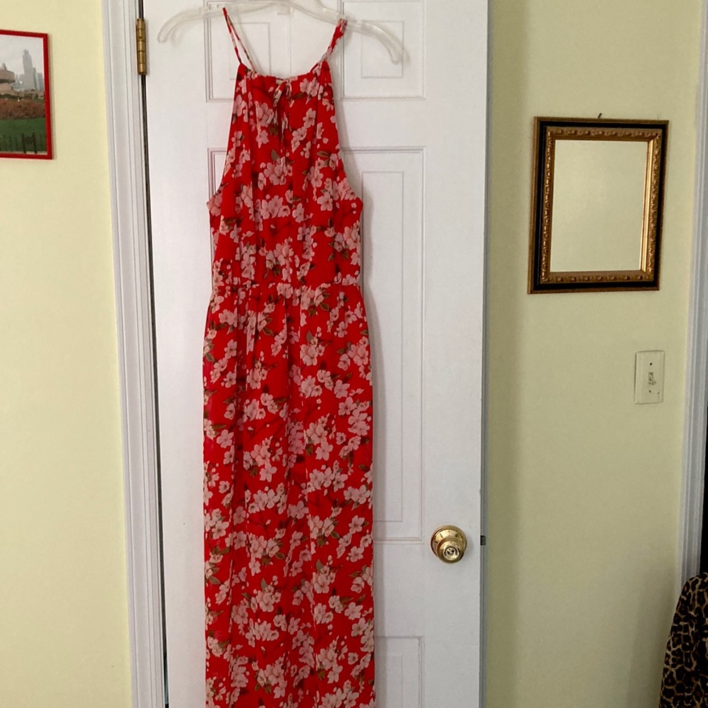 Long, floral/orange,sleeveless,tie-neck  dress.